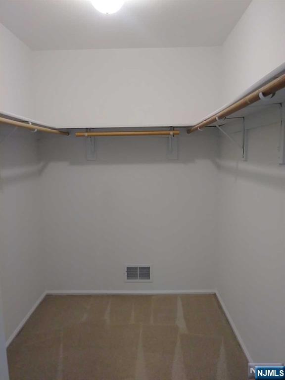 143 Raintree Lane Mahwah, NJ 07430 - Photo 9 of 19 a view of a room with shelf on the wall