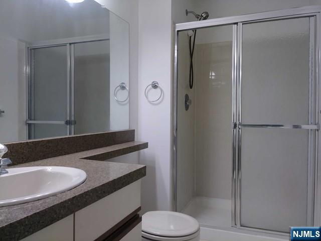 143 Raintree Lane Mahwah, NJ 07430 - Photo 10 of 19 a bathroom with a sink and a mirror