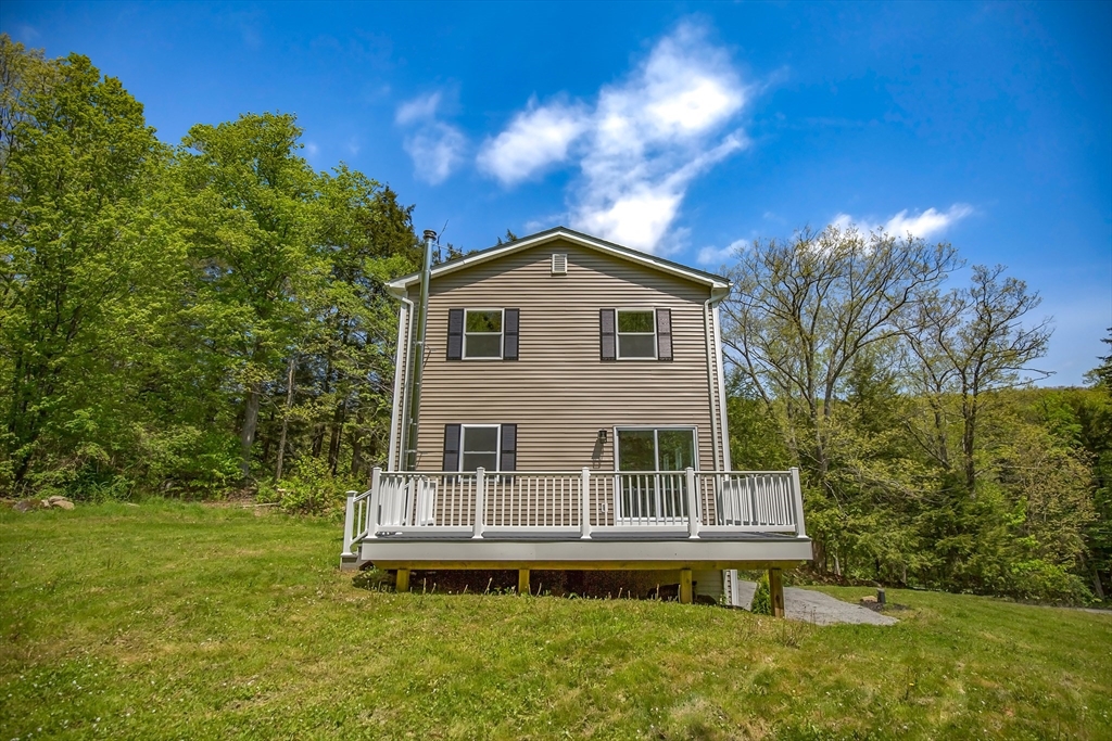 165 Sandisfield Road Sandisfield, MA 01255 - Photo 2 of 37 a front view of a house with a yard