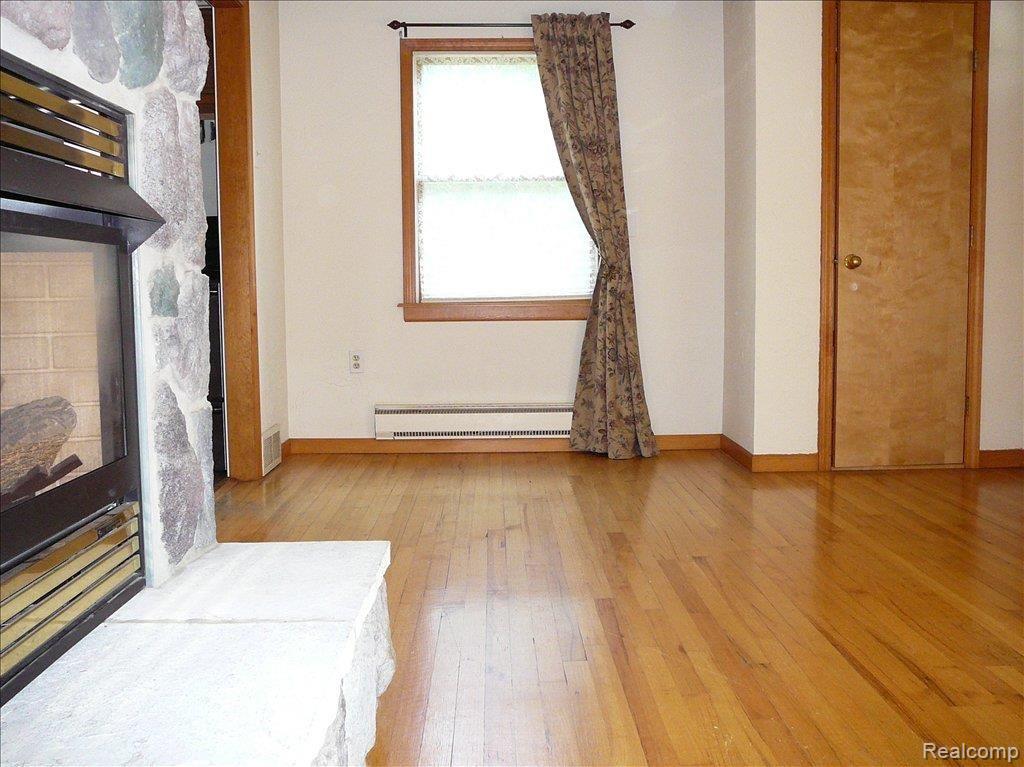 11595 Dewitt Road Belleville, MI 48111 - Photo 11 of 19 Living room with fireplace