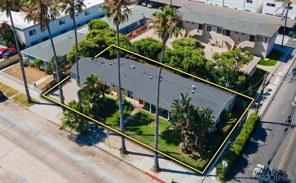 a view of a house with a yard and plants