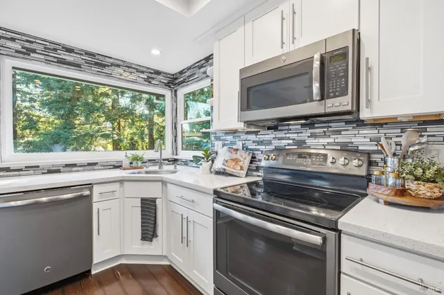 a sink with a view of garden view
