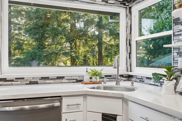 a dining room with furniture a rug and wooden floor