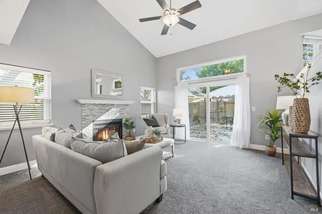 a living room with furniture and a lamp