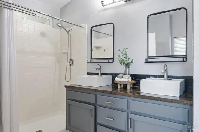 a bath room with a sink and a bath tub