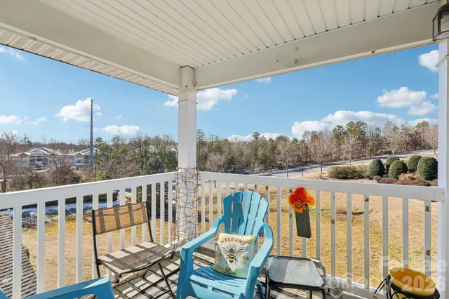 a view of a balcony with furniture