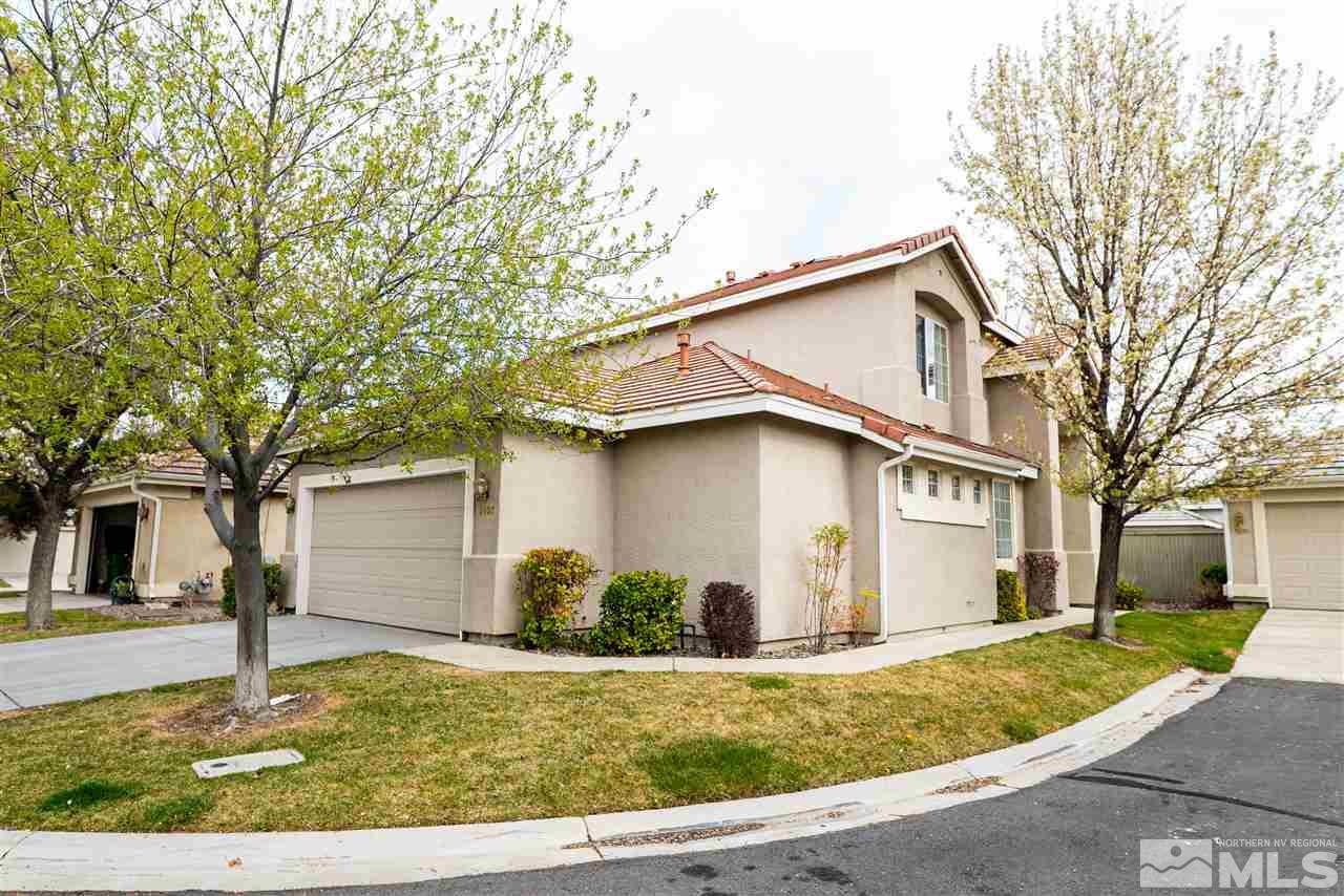 9693 Otter Way Reno, NV 89521 - Photo 2 of 21 a white house that has tree in front of it