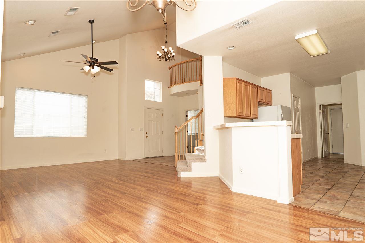9693 Otter Way Reno, NV 89521 - Photo 5 of 21 a view of a kitchen with a sink cabinets and wooden floor