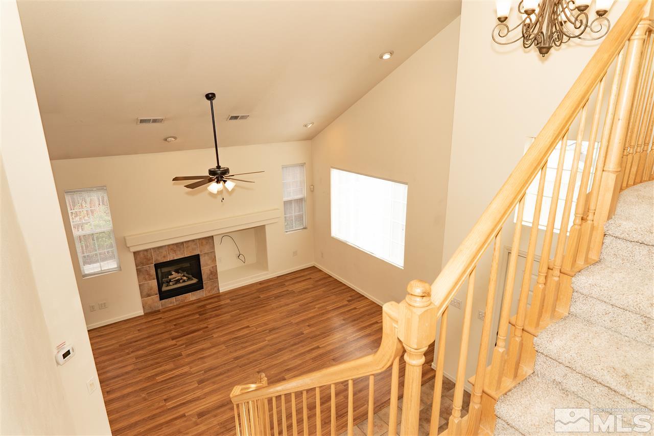9693 Otter Way Reno, NV 89521 - Photo 6 of 21 a view of a livingroom with furniture window and wooden floor