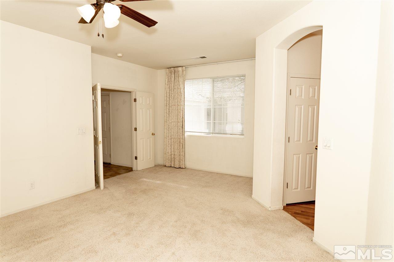9693 Otter Way Reno, NV 89521 - Photo 10 of 21 an empty room with windows and closet