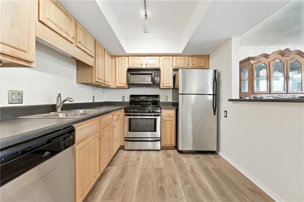3301 Henderson Mill Road, Unit AA3 Atlanta, GA 30341 - Photo 12 of 32 a kitchen with a refrigerator and a sink