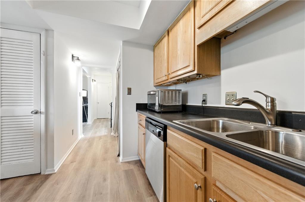 3301 Henderson Mill Road, Unit AA3 Atlanta, GA 30341 - Photo 15 of 32 a kitchen with stainless steel appliances granite countertop a sink and cabinets