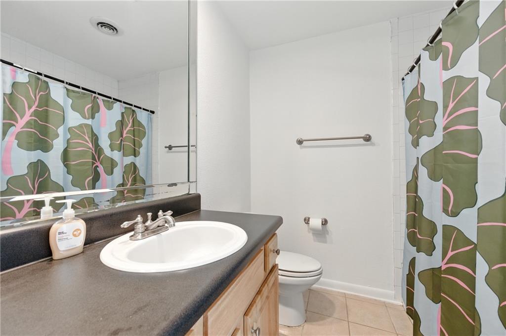 3301 Henderson Mill Road, Unit AA3 Atlanta, GA 30341 - Photo 25 of 32 a bathroom with a sink and a mirror