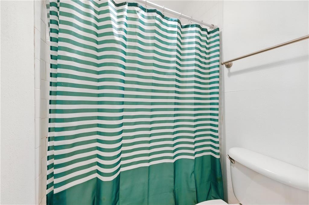3301 Henderson Mill Road, Unit AA3 Atlanta, GA 30341 - Photo 27 of 32 a bathroom with a sink and a mirror