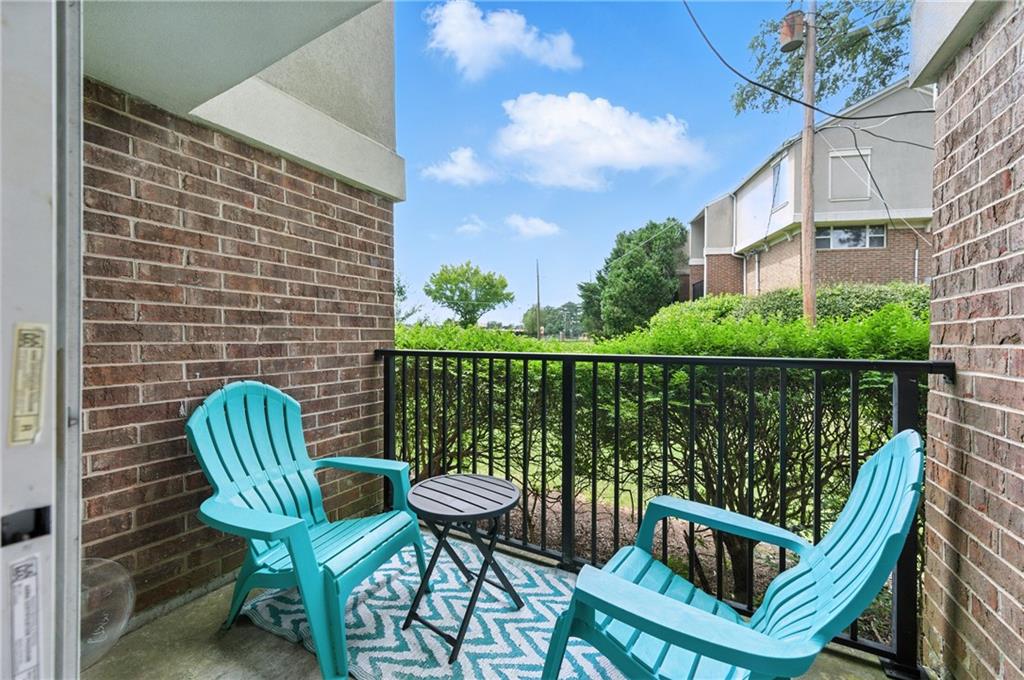 3301 Henderson Mill Road, Unit AA3 Atlanta, GA 30341 - Photo 28 of 32 a view of a chair and table in the balcony