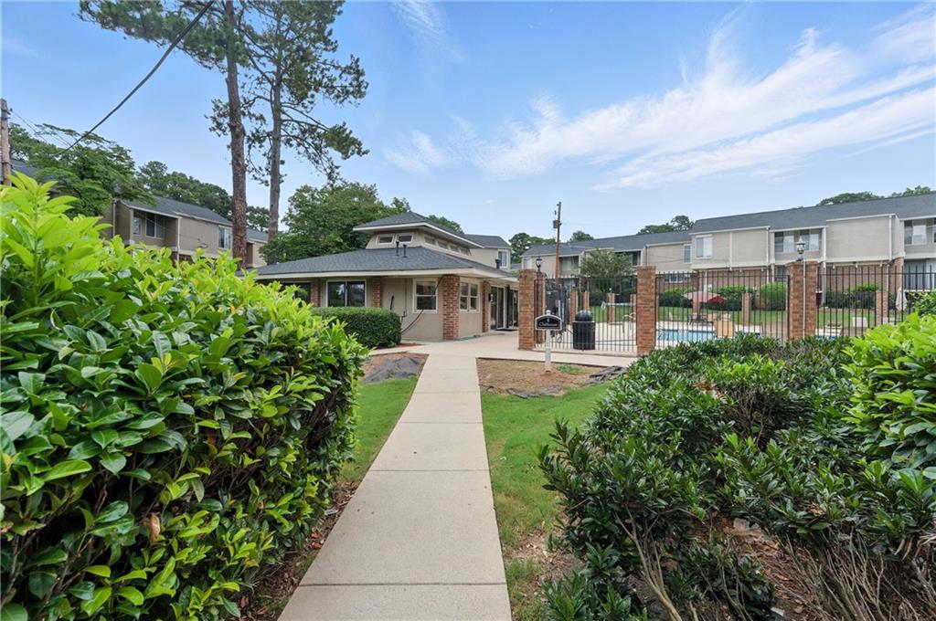 3301 Henderson Mill Road, Unit AA3 Atlanta, GA 30341 - Photo 29 of 32 a view of a building with a yard
