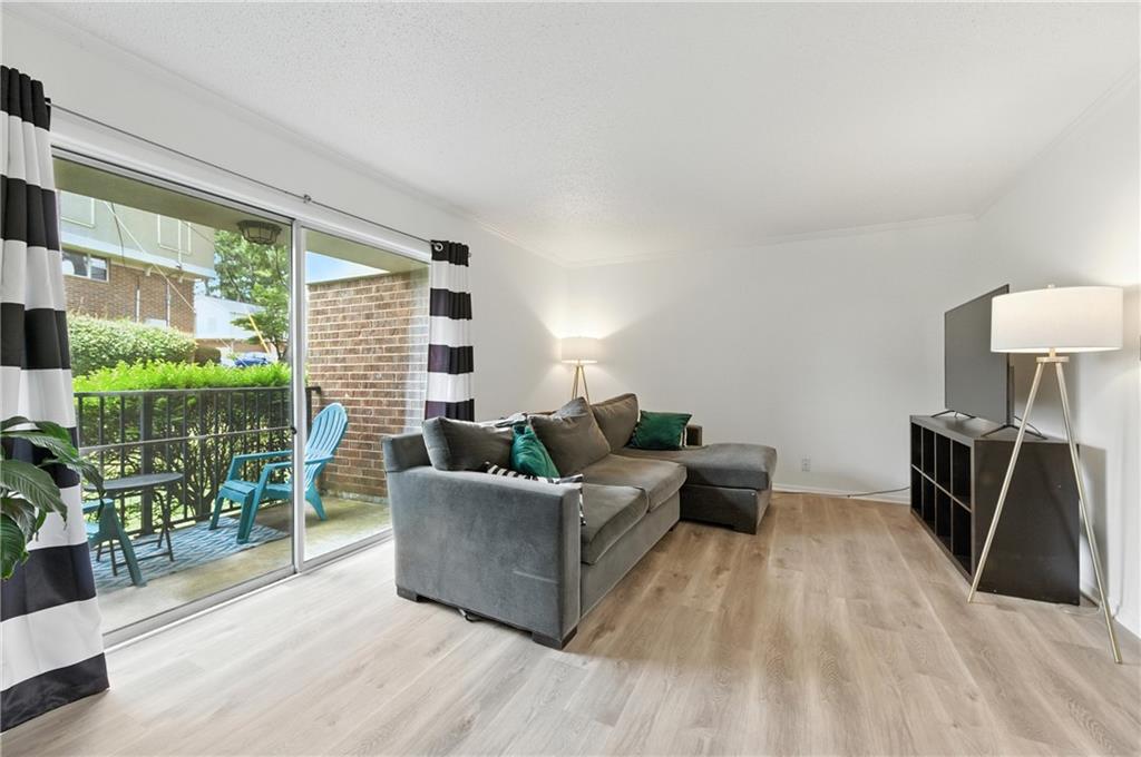 3301 Henderson Mill Road, Unit AA3 Atlanta, GA 30341 - Photo 5 of 32 a living room with furniture and a large window