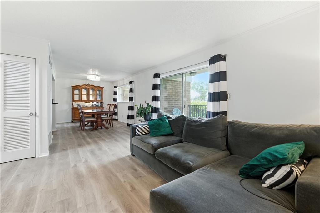 3301 Henderson Mill Road, Unit AA3 Atlanta, GA 30341 - Photo 7 of 32 a living room with furniture and wooden floor