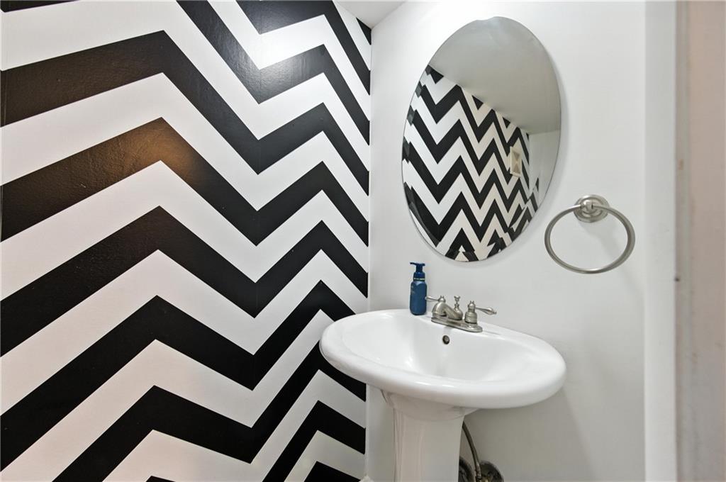 3301 Henderson Mill Road, Unit AA3 Atlanta, GA 30341 - Photo 8 of 32 a bathroom with a sink a mirror and a shower curtain