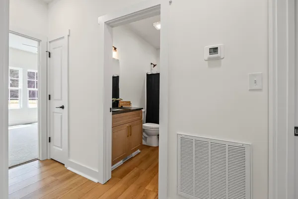 a view of a bathroom from the hallway