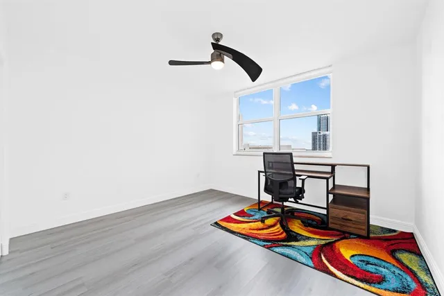 a room with furniture and wooden floor