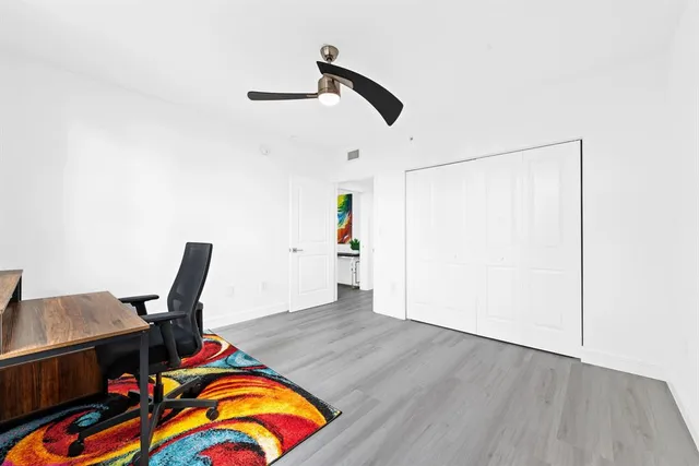 a workspace with furniture and wooden floor