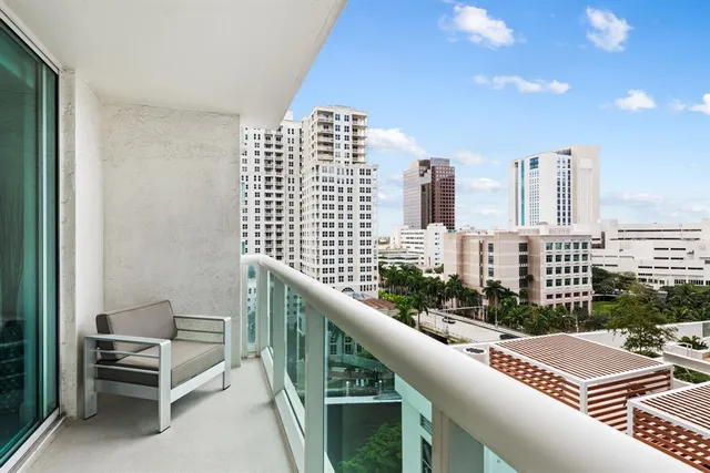a view of balcony with outdoor seating and city view