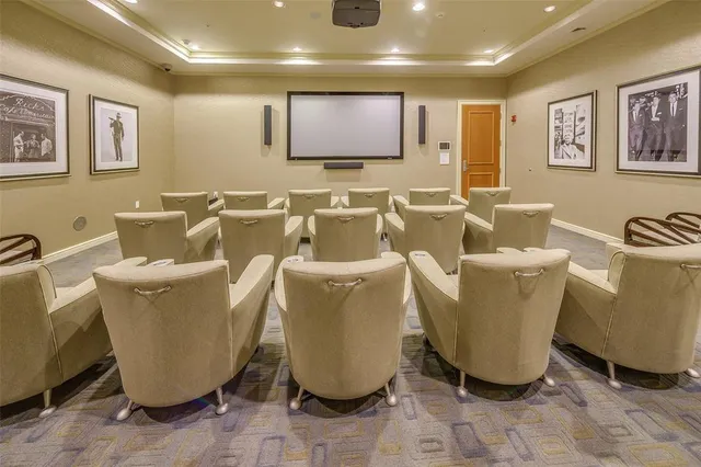 a room with furniture pool table wooden floor and windows