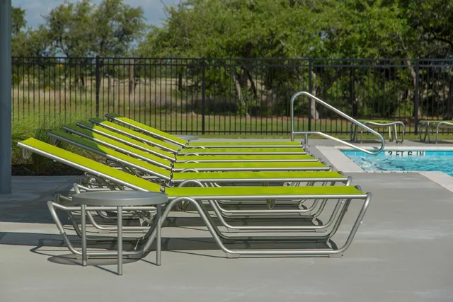 a view of a park with a slide and a lake view