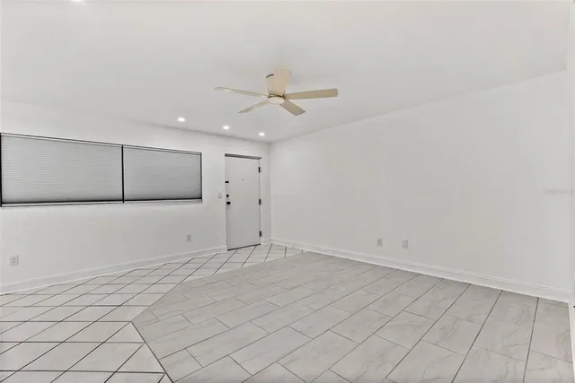 an empty room with fan