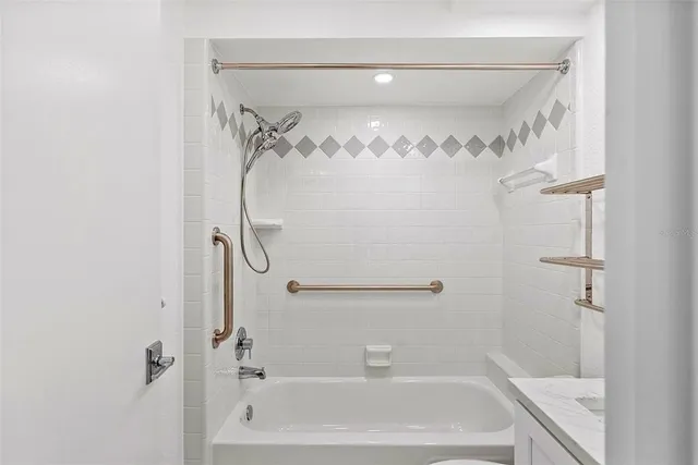 a bathroom with a shower and a bath tub