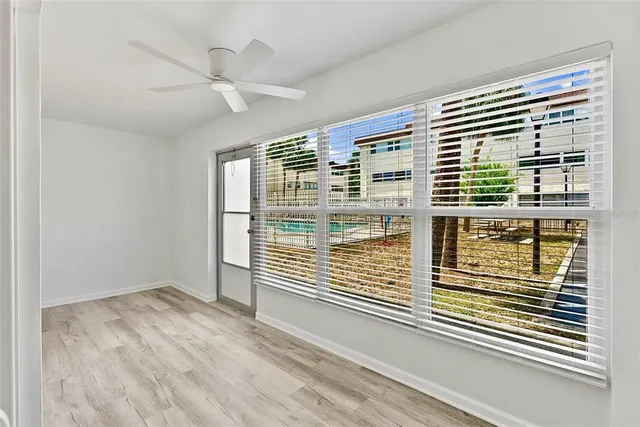 a view of a balcony and a ceiling fan