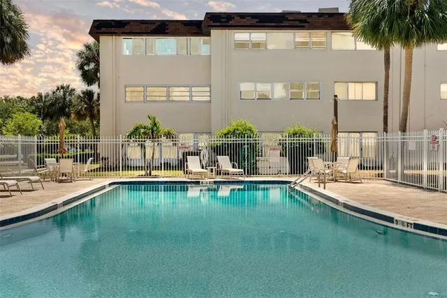 a view of a swimming pool with a patio