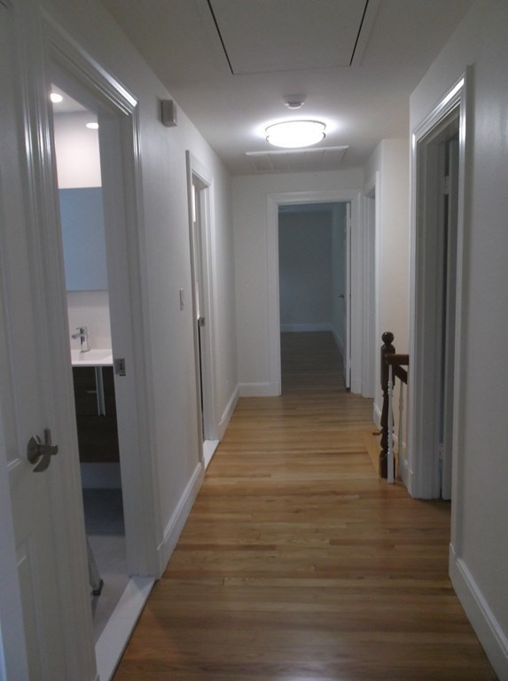 45 Wellesley Road Belmont, MA 02478 - Photo 21 of 42 a view of a hallway with wooden floor