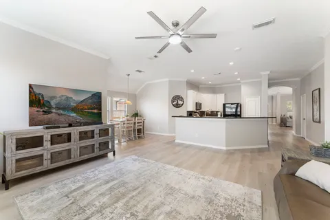 a view of a livingroom with furniture and a flat screen tv