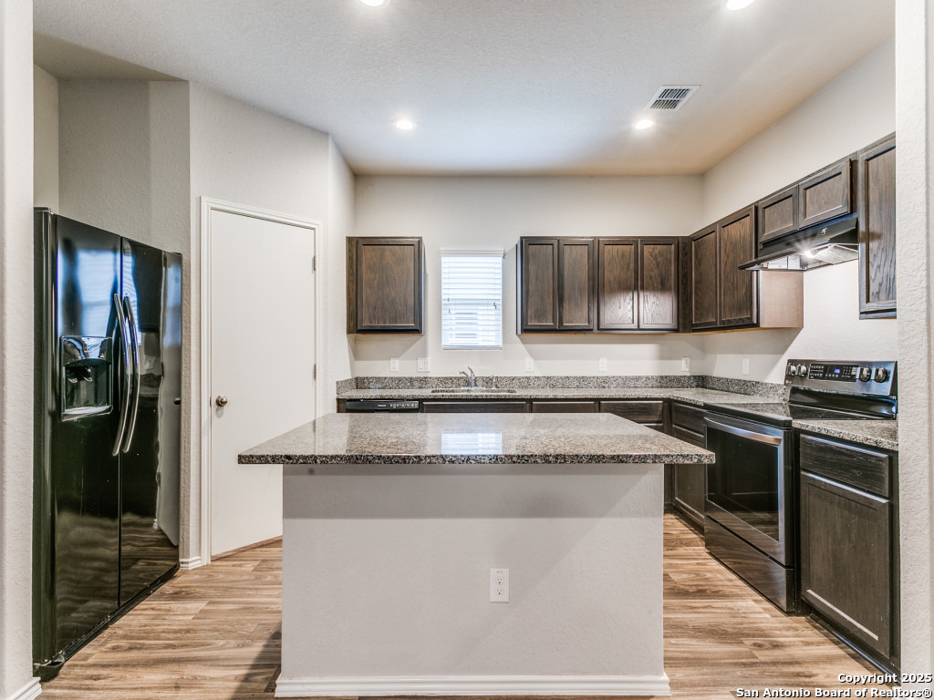 9410 Sandy Rdg Way San Antonio, TX 78239 - Photo 1 of 19 a kitchen with stainless steel appliances granite countertop a stove a refrigerator and a sink