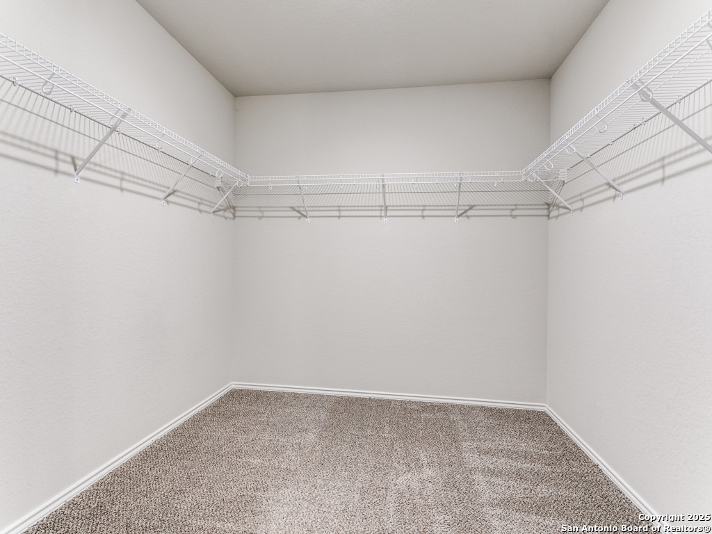 9410 Sandy Rdg Way San Antonio, TX 78239 - Photo 12 of 19 a view of a room with racks on the wall