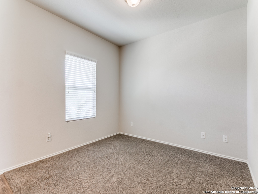 9410 Sandy Rdg Way San Antonio, TX 78239 - Photo 4 of 19 an empty room with a window