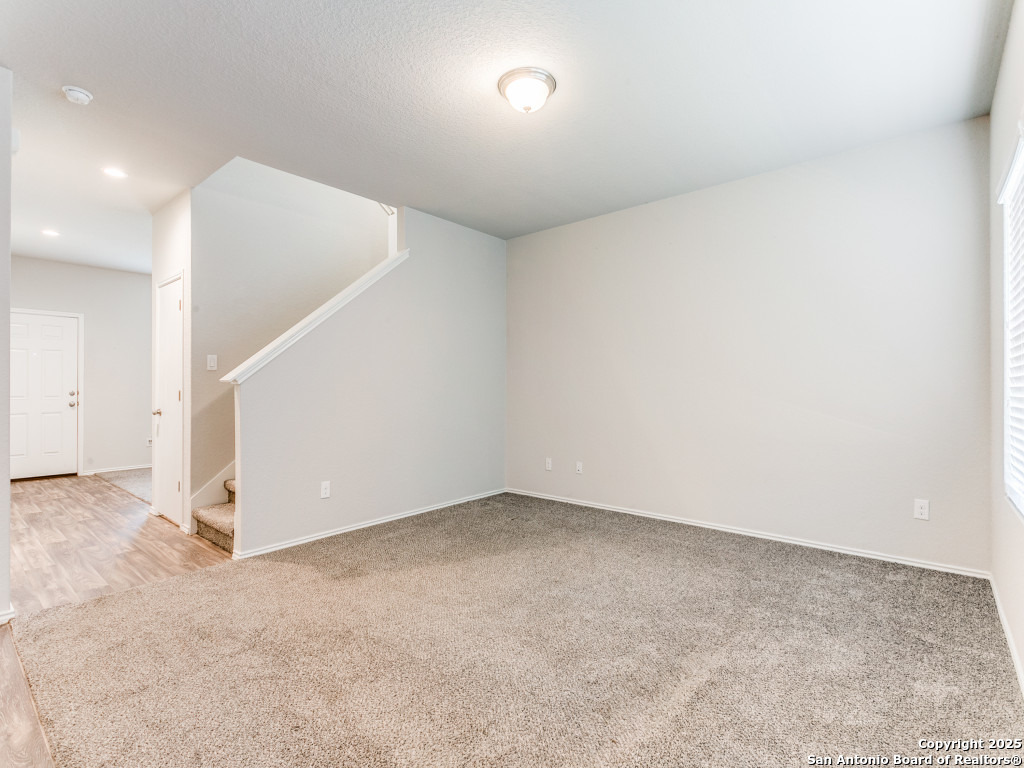9410 Sandy Rdg Way San Antonio, TX 78239 - Photo 5 of 19 an empty room with a ceiling fan and entryway