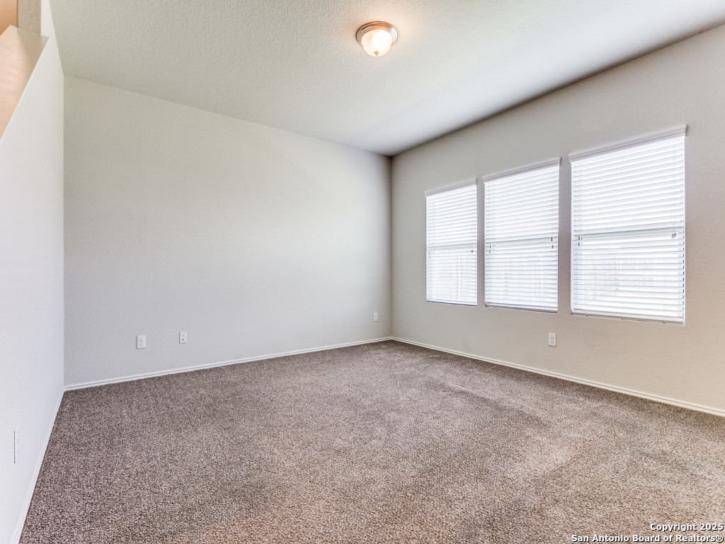 9410 Sandy Rdg Way San Antonio, TX 78239 - Photo 6 of 19 an empty room with windows