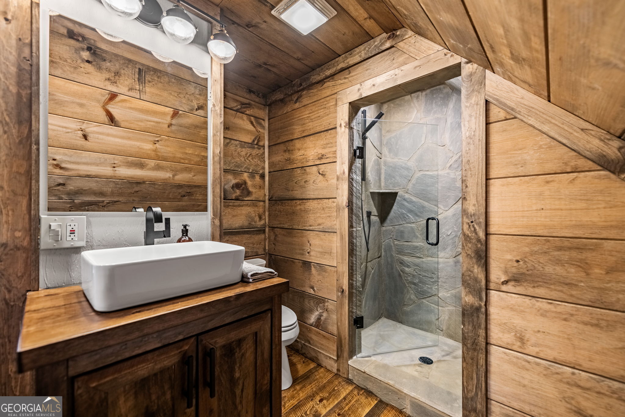 184 Spence Road Blue Ridge, GA 30513 - Photo 47 of 90 a bathroom with a sink and a mirror