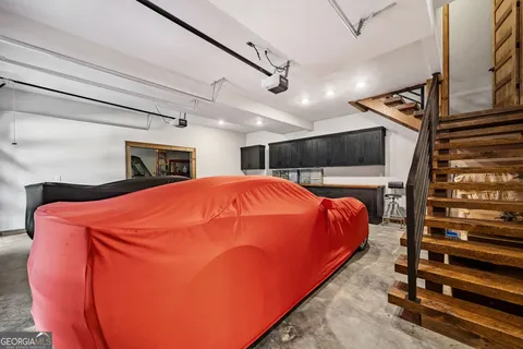 a view of a red car park in front of a building