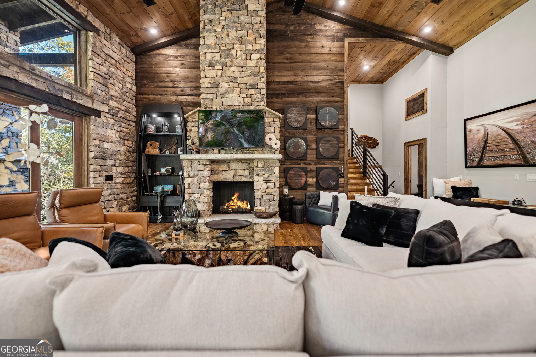 184 Spence Road Blue Ridge, GA 30513 - Photo 56 of 90 a living room with furniture and a fireplace