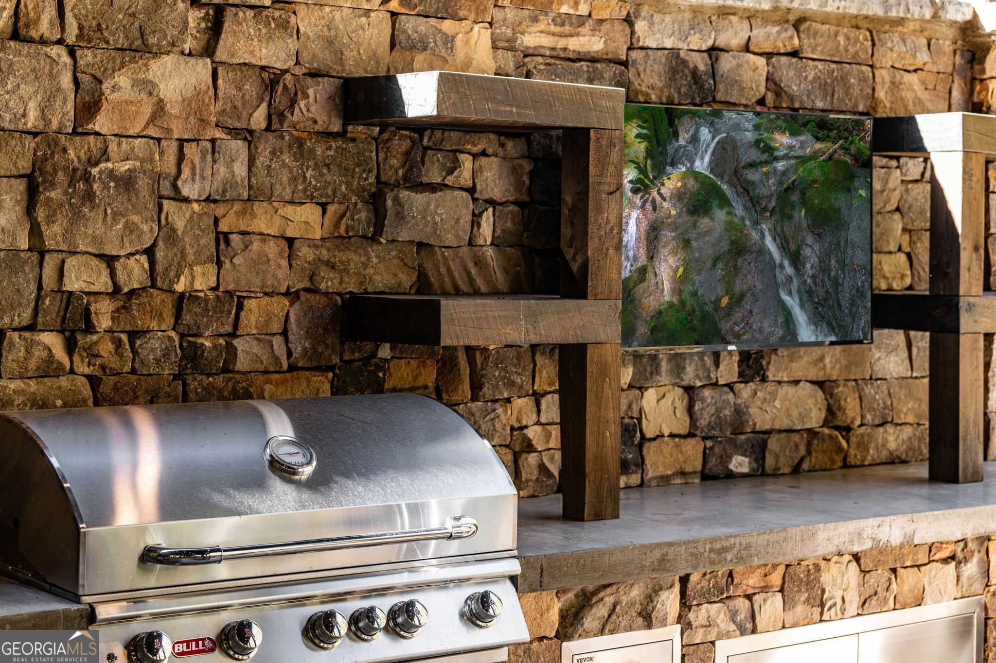 184 Spence Road Blue Ridge, GA 30513 - Photo 81 of 90 a closeup of a stove with wooden floor