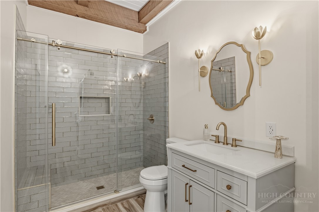 355 South River Hills Road Lansing, NC 28643 - Photo 20 of 45 a bathroom with a sink toilet and shower