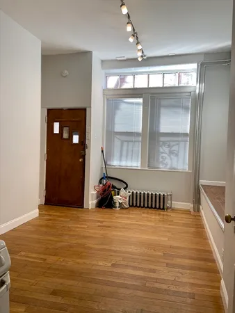 a view of a room with a bed