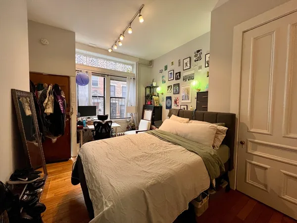 a bed room with a bed and furniture