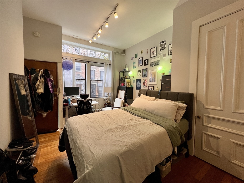 83 West Cedar Street, Unit 1 Boston, MA 02114 - Photo 12 of 15 a bed room with a bed and furniture