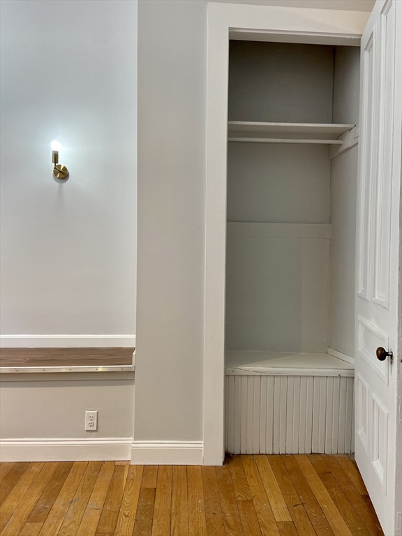 83 West Cedar Street, Unit 1 Boston, MA 02114 - Photo 7 of 15 a view of walk in closet with empty racks