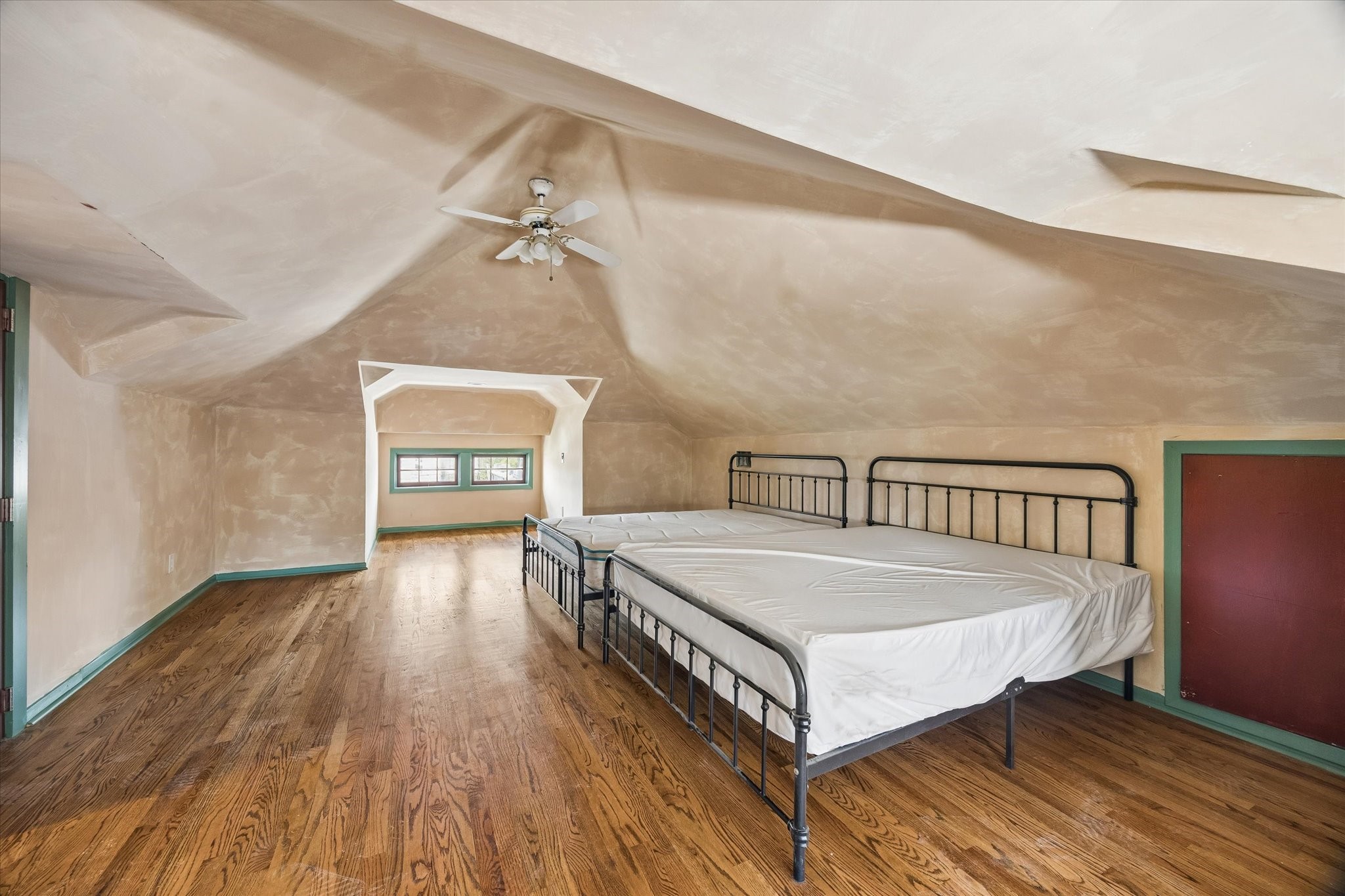 239 Westheimer Road Houston, TX 77006 - Photo 21 of 42 MAIN HOUSE - TOP FLOOR: Upstairs, the media room is defined by its soaring vaulted ceilings, creating an airy, expansive feel. Its versatile layout allows for countless uses, all while remaining tucked away from the rest of the home for added privacy...
